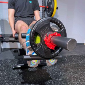Mans feet using Tibialis Bar and weight plate